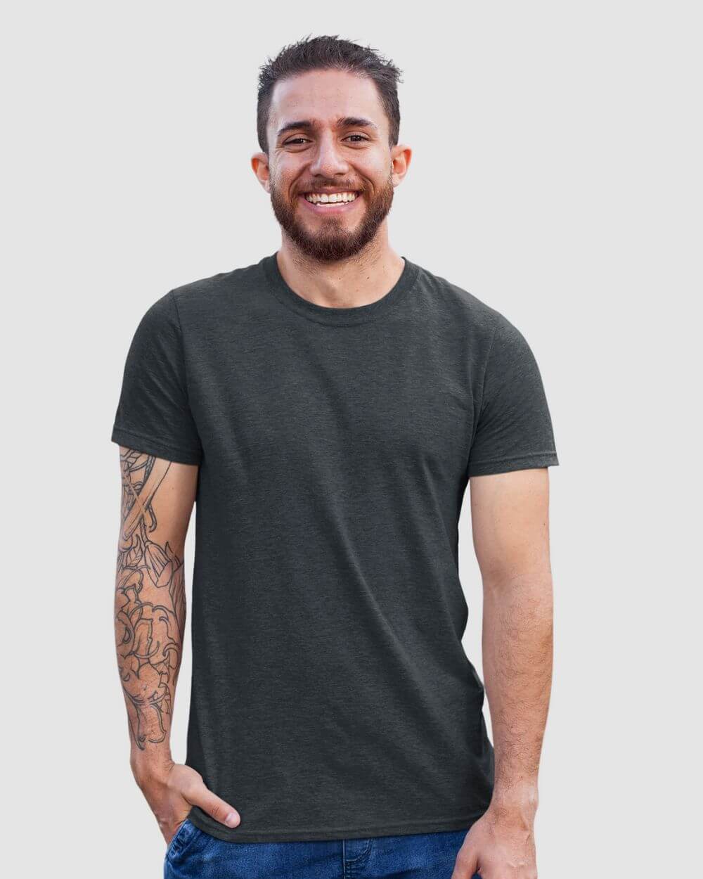 Smiling man wearing a dark crewneck shirt, showcasing comfort and style from the Monak collection.