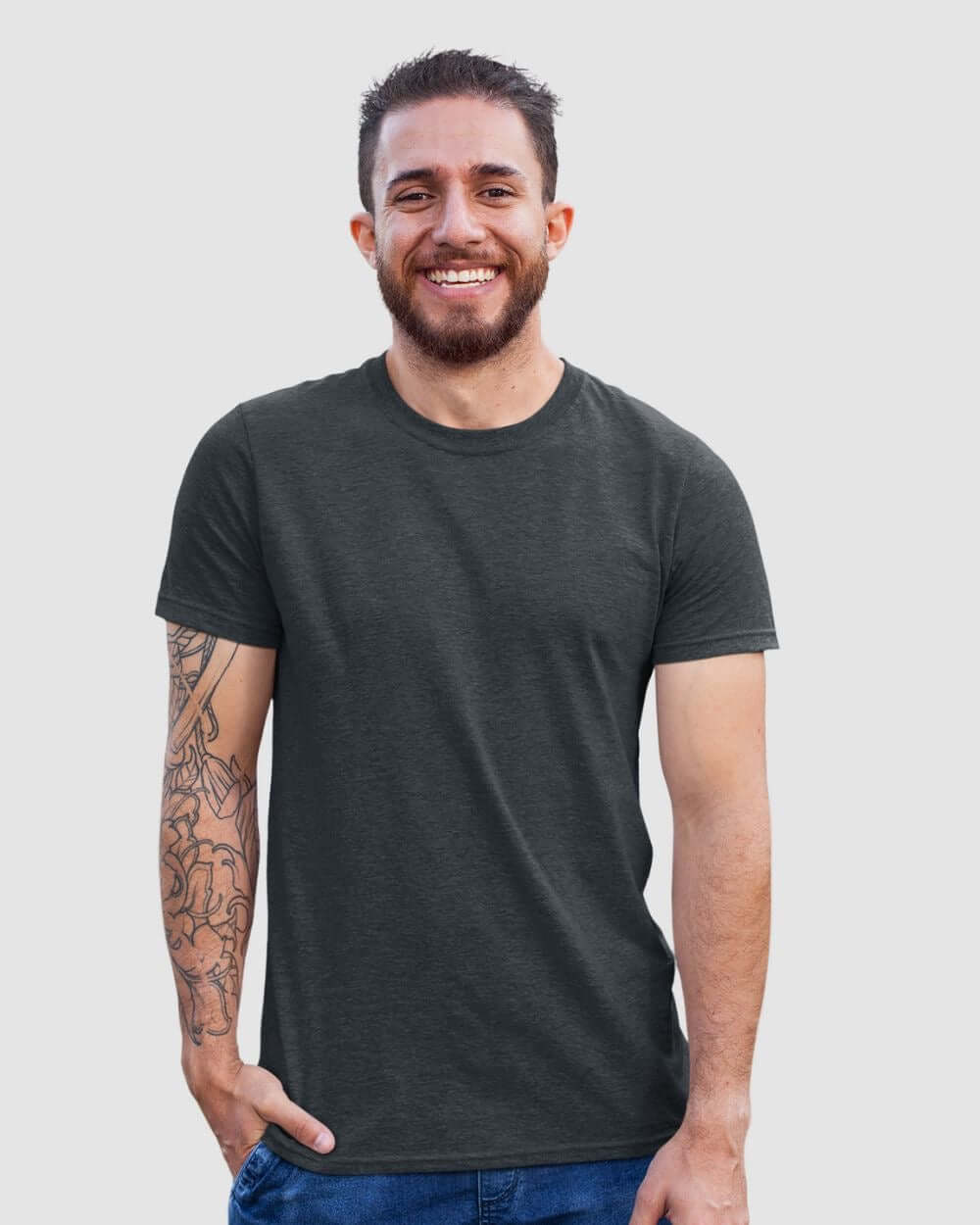 Man wearing a dark crewneck t-shirt, smiling, showcasing the comfort and fit of the Monak Crewneck Single.