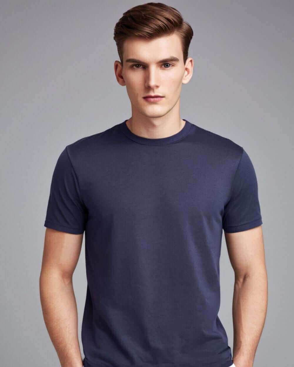 Male model wearing a navy blue crewneck t-shirt, showcasing comfort and style with classic fit.