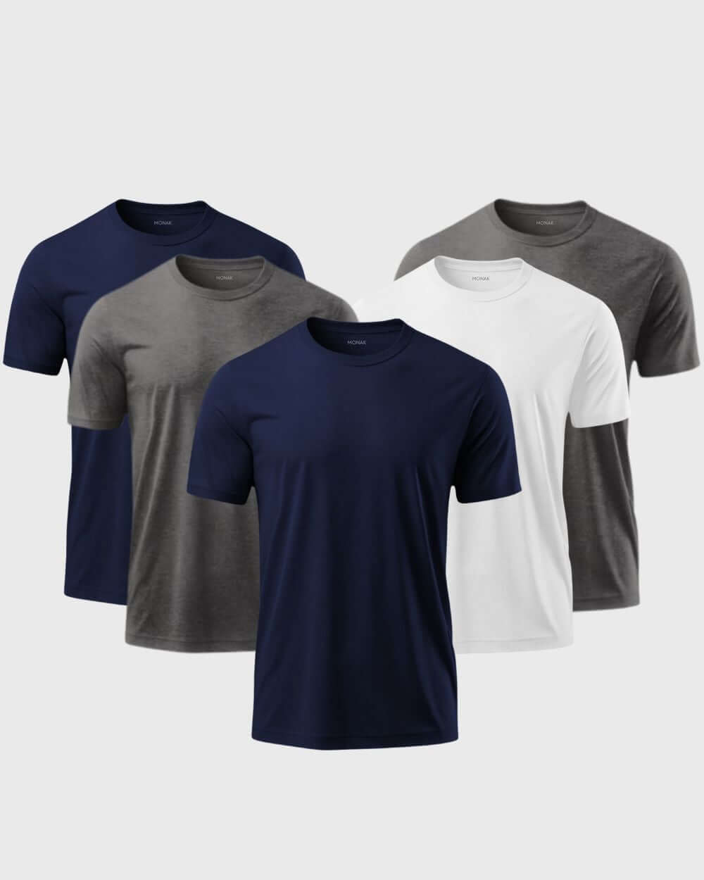 Monak Crewneck 5 pack t-shirts in navy, grey, and white, showcasing comfort and durability in a stylish arrangement.